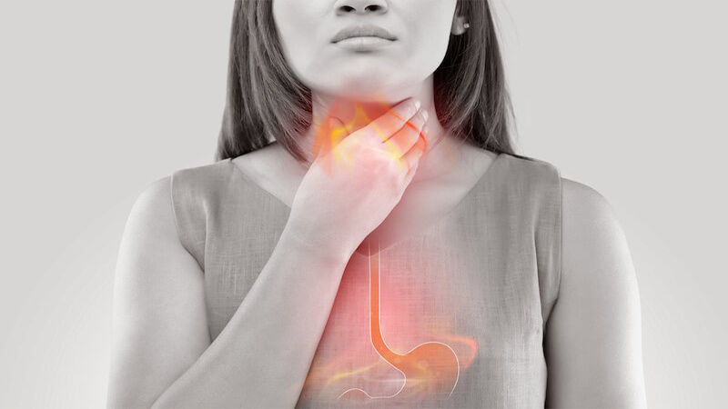What are the symptoms of indigestion and heartburn